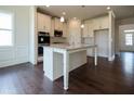 Island kitchen with stainless steel appliances and granite countertops at 7179 Linden Dr, South Fulton, GA 30349