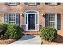 Black front door with arched window and sidelights at 882 Edgewater Trl, Atlanta, GA 30328