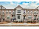 Three-unit townhome building with brick facade and landscaping at 2071 Glenview Park Cir, Duluth, GA 30097