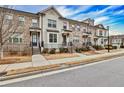 Row of townhomes showcasing brick exteriors and neat landscaping at 2071 Glenview Park Cir, Duluth, GA 30097