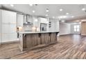 Modern kitchen with two-toned cabinetry, granite island, and stainless steel appliances at 2071 Glenview Park Cir, Duluth, GA 30097