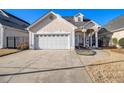 Charming home boasts a well-manicured lawn, a two-car garage, and a stucco exterior at 102 Prestwick S Way, Stockbridge, GA 30281