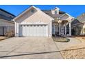 Charming home boasts a well-manicured lawn, a two-car garage, and a stucco exterior at 102 Prestwick S Way, Stockbridge, GA 30281