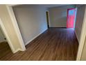 Living room with hardwood floors and a red door at 1876 Selwyn Dr, Decatur, GA 30035