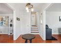 Bright entryway with hardwood floors, staircase, and coat closet at 3970 Somerled Trl, Atlanta, GA 30349