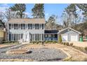 Two-story house with gray siding, shutters, and a two-car garage at 501 Fond Du Lac Dr, Stone Mountain, GA 30088