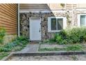 Front door entrance with stone accents at 574 Northridge Crossing Dr, Sandy Springs, GA 30350