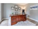 Home office with hardwood floors, large desk, and neutral wall color at 1776 Chadds Lake Ne Dr, Marietta, GA 30068