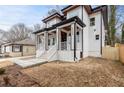 Modern two-story home with white siding and a welcoming front porch at 1416 Elizabeth Sw Ave, Atlanta, GA 30310