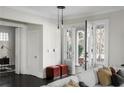 Bright living room with hardwood floors and access to a front porch at 769 Penn Ne Ave, Atlanta, GA 30308