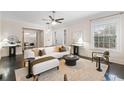 Light-filled living room featuring a sectional sofa and stylish decor at 769 Penn Ne Ave, Atlanta, GA 30308