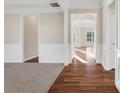 Bright hallway with hardwood floors and neutral walls at 1209 Westgate Dr, Lilburn, GA 30047