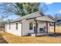 Side view of a white cottage with a covered porch at 363 Roselane Nw St, Marietta, GA 30060