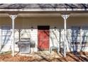 Front porch features a red door and grill at 390 Wayside Dr, Lawrenceville, GA 30046