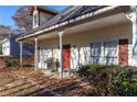 Covered porch with grill and seating area at 390 Wayside Dr, Lawrenceville, GA 30046