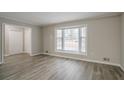 Spacious living room with bay window and neutral color palette at 2026 Morris Dr, Riverdale, GA 30296