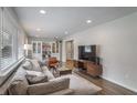 Spacious living area with hardwood floors, sectional sofa, and large windows at 2295 Cloverdale Se Dr, Atlanta, GA 30316