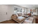 Bright living room with hardwood floors, sectional sofa, and built-in shelving at 2295 Cloverdale Se Dr, Atlanta, GA 30316