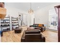 Open concept living room with hardwood floors and a view into the kitchen at 330 Mount Zion Rd, Hapeville, GA 30354