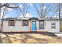 Charming ranch home with teal front door and updated siding at 3460 Fairlane Dr Dr, Atlanta, GA 30331