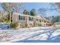 Charming home with a covered front porch and a well-maintained front yard at 3002 Arabian Woods Dr, Lithonia, GA 30038