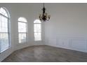 Dining room showcases wood floors, wainscoting detail, and arched windows at 4259 Creek Haven Dr, Marietta, GA 30062