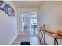 Bright and airy entryway with wood-look floors, showcasing views to the dining area at 795 Tanner Rd, Dacula, GA 30019