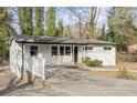 Cozy one-story home with white siding, a covered entryway, and a well-maintained front yard at 2529 Dale Creek Nw Dr, Atlanta, GA 30318