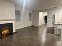 Spacious living room with fireplace and dark hardwood floors at 6615 Bluffview Dr, Douglasville, GA 30134