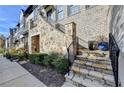 Elegant stone steps leading to the entrance of a townhome at 6770 Cadence Blvd, Atlanta, GA 30328