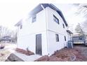 Side view of the house showcasing the garage and additional exterior features at 2688 Heritage Ln, Morrow, GA 30260