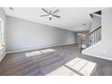 Spacious living room featuring carpet and large windows at 4194 Integrity Way, Powder Springs, GA 30127