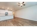 Open living area with hardwood floors and island kitchen at 1267 Sunny Lake Dr, Lawrenceville, GA 30043