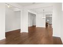 Spacious dining room with hardwood floors and views to the kitchen at 1682 Juniper Berry Way, Loganville, GA 30052