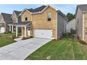 Two-story brick home with a side view showcasing landscaping at 1862 Weatherbrook Cir, Lawrenceville, GA 30043