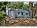 Attractive single-story home with a classic facade, complemented by mature trees and landscaping at 1626 Kenmore Sw St, Atlanta, GA 30311