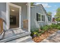 House entrance with wooden railing and steps at 1626 Kenmore Sw St, Atlanta, GA 30311