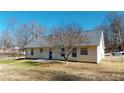 House's back exterior with patio and fenced yard at 4002 Cheoah Dr, Douglasville, GA 30135