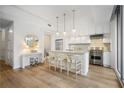 Modern kitchen with stainless steel appliances and an island at 1820 Peachtree Nw St # 303, Atlanta, GA 30309