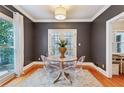 Charming breakfast nook with a round table and four chairs at 975 Seaboard Nw Ave, Atlanta, GA 30318