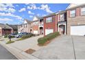 Townhome community featuring multiple units and parking at 2277 Hawks Bluff Trl, Lawrenceville, GA 30044