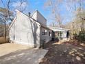 Rear view of house showcasing a screened porch and fenced yard at 6049 Shallow Wood Ct, Douglasville, GA 30135