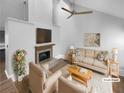 Virtually staged living room with fireplace and hardwood floors at 6049 Shallow Wood Ct, Douglasville, GA 30135