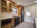 Modern kitchen with stainless steel appliances and light oak cabinets at 1098 Jefferson Ave, East Point, GA 30344