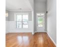 Bright entryway with hardwood floors and white trim at 230 Ascott Ln, Woodstock, GA 30189