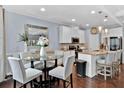 Modern kitchen with white cabinets and a granite island at 2805 Ellis Pointe Ave, Conyers, GA 30094