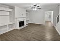 Bright living room featuring hardwood floors and fireplace at 1710 Garbrooke Cv, Lawrenceville, GA 30046