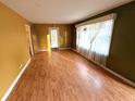 Spacious living room with laminate floors and large windows at 891 Daniell Se Dr, Smyrna, GA 30080