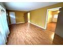 Laminate floors and neutral walls in this open living room at 891 Daniell Se Dr, Smyrna, GA 30080