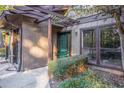 Townhouse entryway with green door and landscaping at 3948 Cedar Cir, Tucker, GA 30084